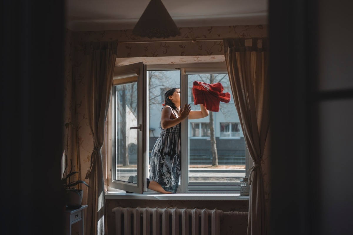 woman cleaning the windows