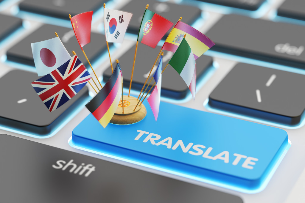 translate blue keyboard with flags stuck in it