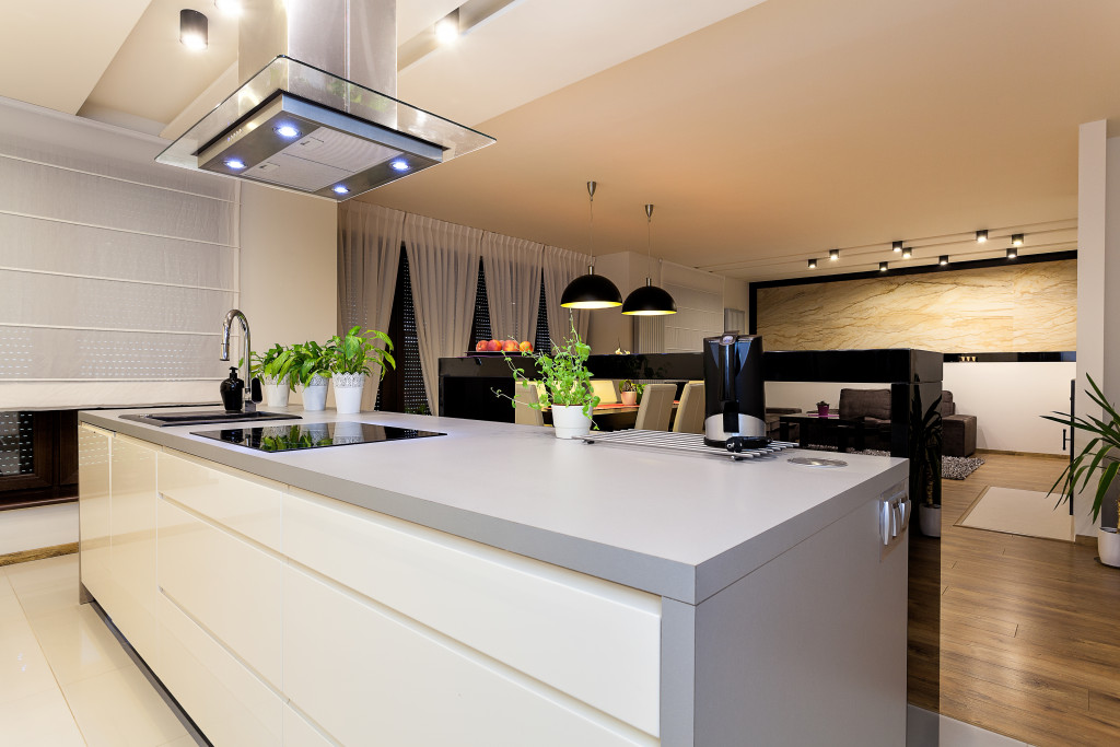 an urban apartment with white countertop in kitchen